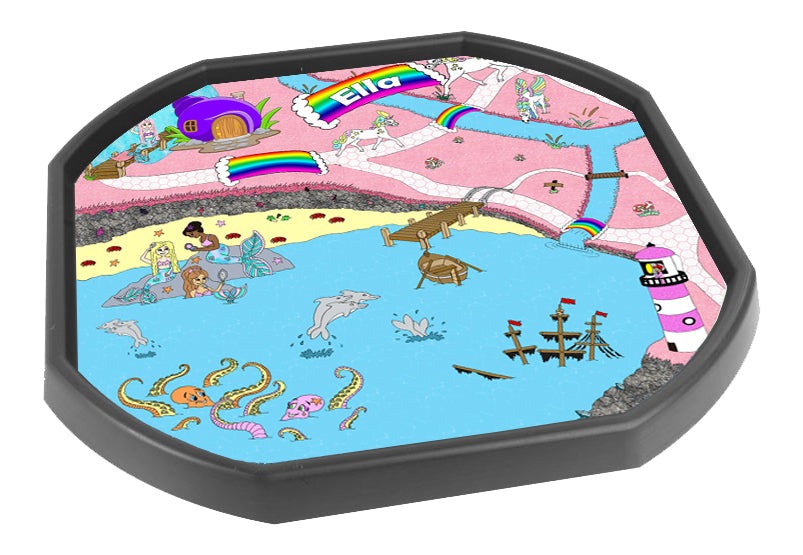 The personalised Mermaid Lagoon mat is ideal for use with a Tuff Tray and features your child's name on a rainbow! Swim in lagoons with mermaids in enchanted worlds, with unicorns, a shell house, dolphins, a lighthouse and  rainbow bridges. Ideal for imaginative play!